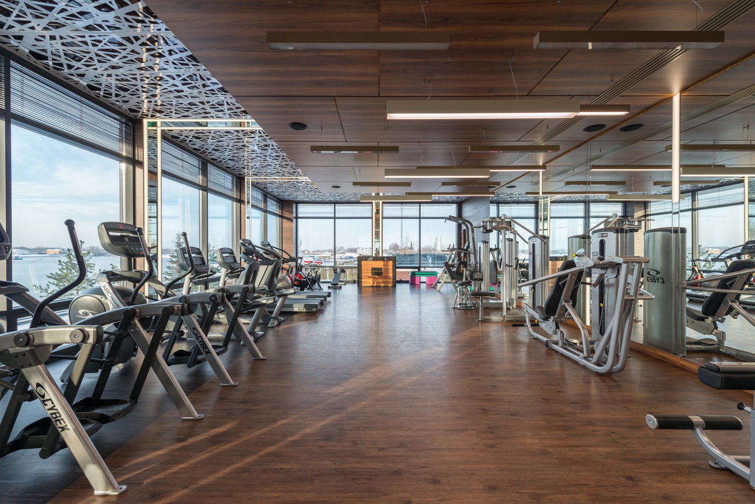 Various fitness machines in modern spacious gym